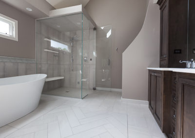 master bathroom steam shower double vanity soaker tub chevron tile remodel