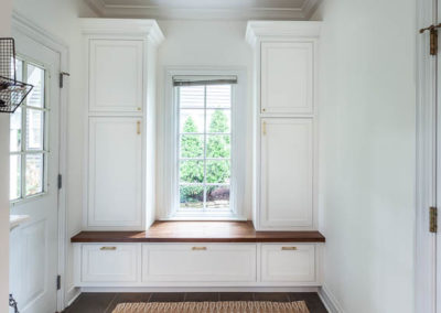 mudroom locker cabinet wood countertop white cabinetry clarendon hills illinois