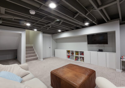 basement remodel exposed beams gray ceiling carpet clarendon hills illinois