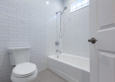 rustic vanity open shelves inset double vanity hall bathroom remodel gray tile white subway tile clarendon hills illinois