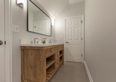 rustic vanity open shelves inset double vanity hall bathroom remodel gray tile white subway tile clarendon hills illinois