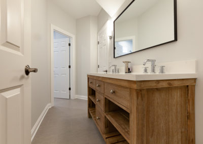 rustic vanity open shelves inset double vanity hall bathroom remodel gray tile white subway tile clarendon hills illinois
