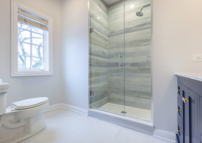 en suite bathroom remodel navy freestanding vanity furniture vanity marmara marble tile striped