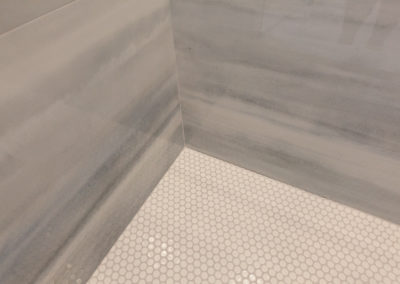 en suite bathroom remodel navy freestanding vanity furniture vanity marmara marble tile striped