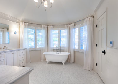 master bathroom remodel his her vanity marble vintage antique subway tile off white tile wainscoting freestanding soaker tub