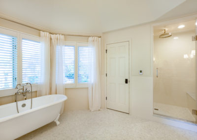 master bathroom remodel his her vanity marble vintage antique subway tile off white tile wainscoting freestanding soaker tub