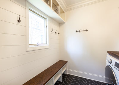 mudroom bench hooks laundry room wood top simple design dark gray tile