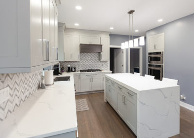 kitchen remodel shaker full overlay walnut hood waterfall island quartz countertop clarendon hills illinois contemporary