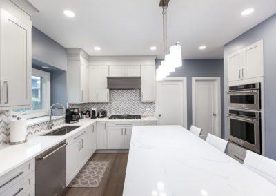 kitchen remodel shaker full overlay walnut hood waterfall island quartz countertop clarendon hills illinois contemporary