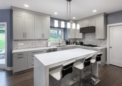 kitchen remodel shaker full overlay walnut hood waterfall island quartz countertop clarendon hills illinois contemporary