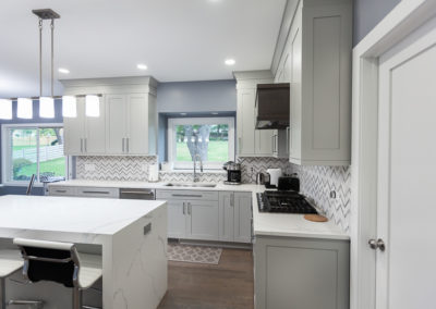 kitchen remodel shaker full overlay walnut hood waterfall island quartz countertop clarendon hills illinois contemporary