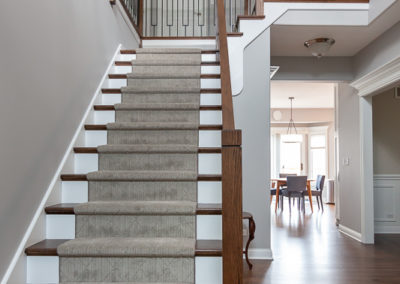 modern staircase remodel iron balusters stained handrail elmhurst, illinois