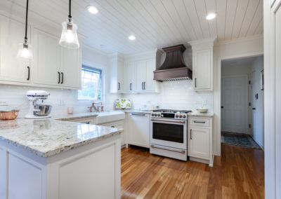 farmhouse kitchen remodel laundry room herringbone shiplap ceiling vintage range white kitchen granite subway backsplash