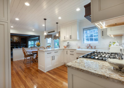 farmhouse kitchen remodel laundry room herringbone shiplap ceiling vintage range white kitchen granite subway backsplash