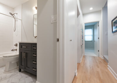 navy vanity hallway bathroom remodel tub hyland homes chicago illinois