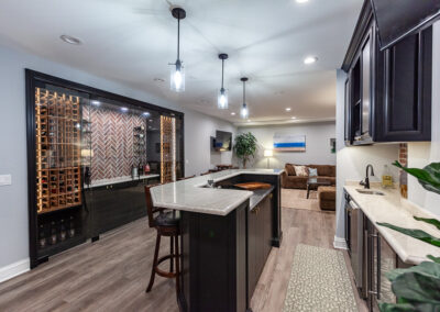 basement bar and wine room storage brick backsplash hyland homes clarendon hills, illinois