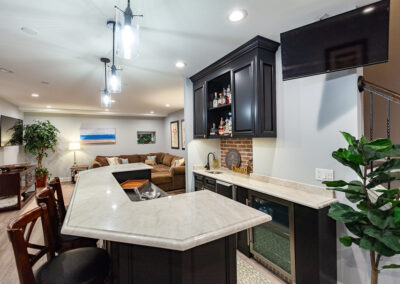 basement bar and wine room storage brick backsplash hyland homes clarendon hills, illinois